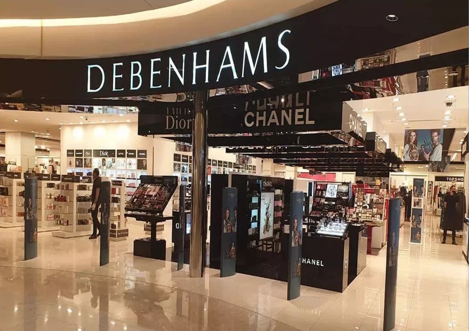 Debenhams store entrance with beauty counters beneath illuminated signage